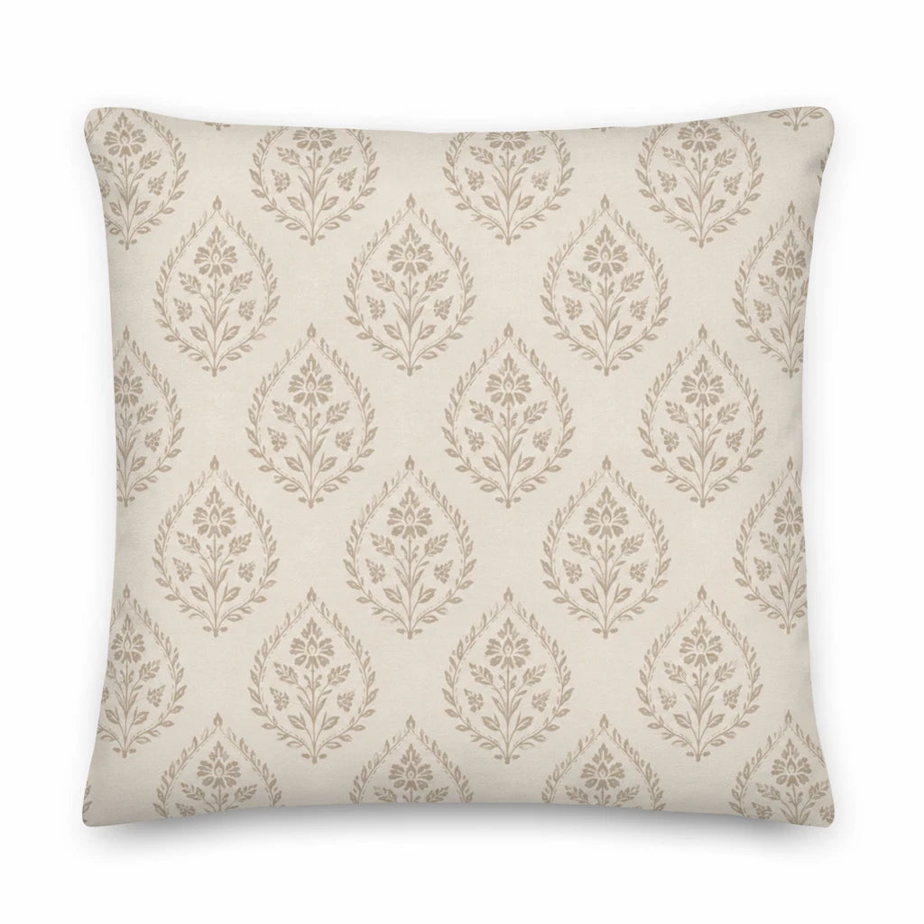 Decorative pillow with a leaf pattern on a beige background