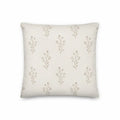 Decorative pillow with subtle floral pattern on a plain background